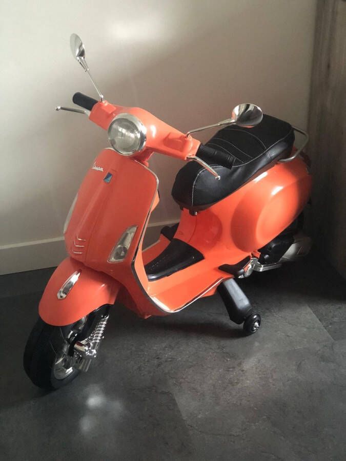 Vespa Elektrische kinder Primavera 12 volt elektrische kinderscooter met muziek AUX en USB (Oranje)