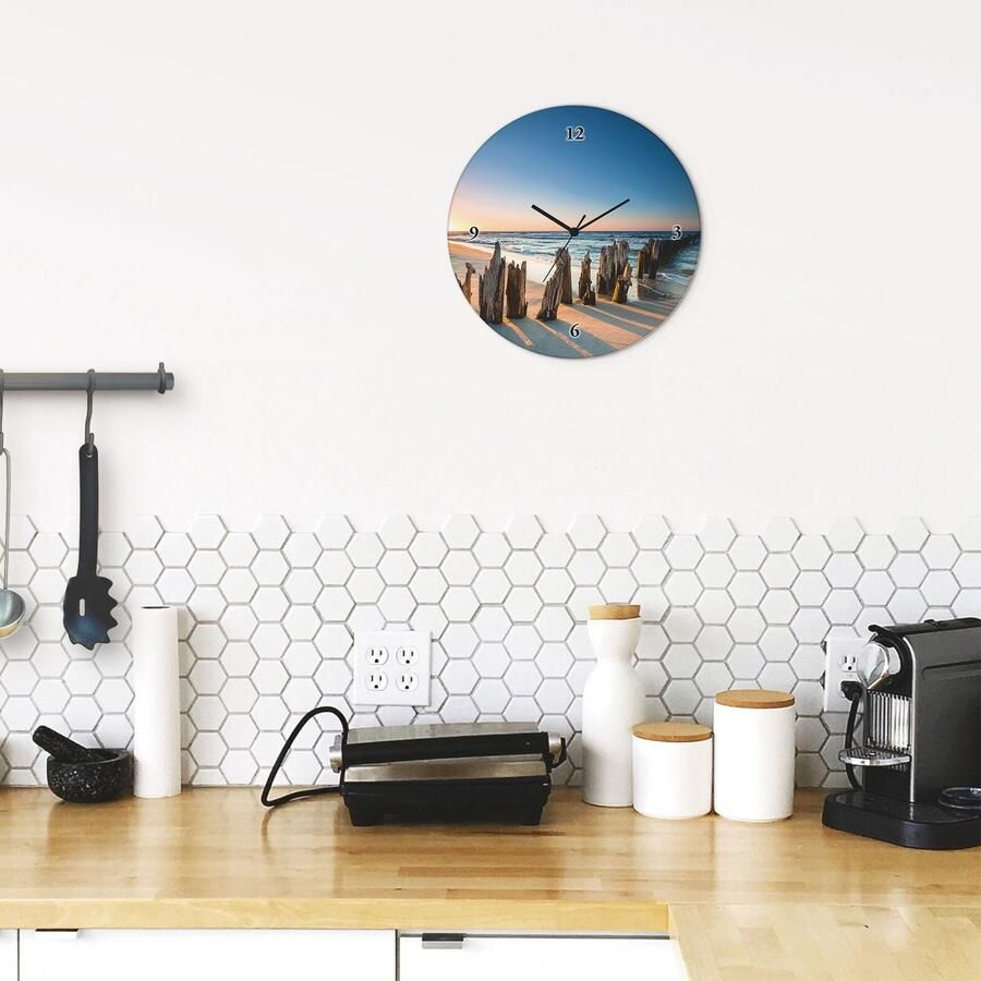 Artland Wandklok Glazen klok rond zonsondergang strand golfbreker